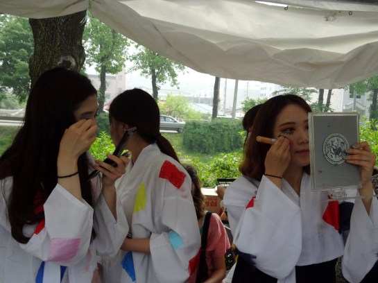 Locals painting themselves.